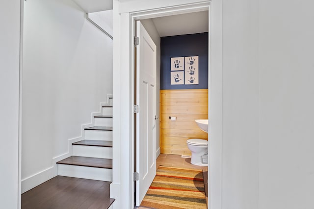 stairs with wood finished floors