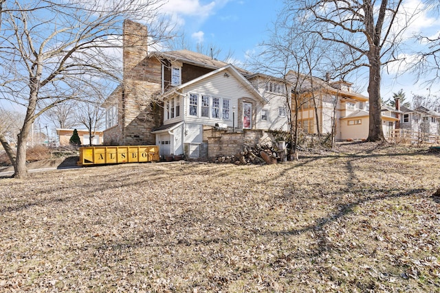 view of property exterior with a chimney