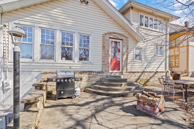 exterior space with stone siding