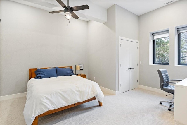 40 US Pl Unit 2B, Sunrise Beach, MO 65079 - bedroom with visible vents, ceiling fan, baseboards, carpet floors, and a closet