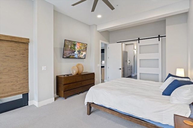 40 US Pl Unit 2B, Sunrise Beach, MO 65079 - carpeted bedroom with connected bathroom, baseboards, a barn door, recessed lighting, and a ceiling fan