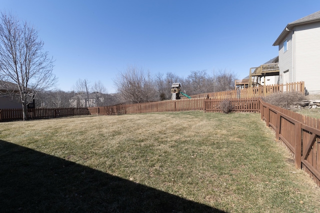 view of yard featuring a playground and a fenced backyard