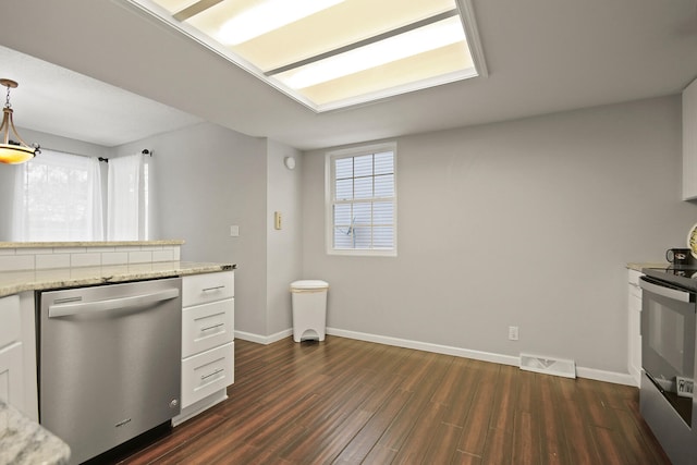 kitchen with visible vents, dark wood-type flooring, electric range oven, white cabinets, and stainless steel dishwasher