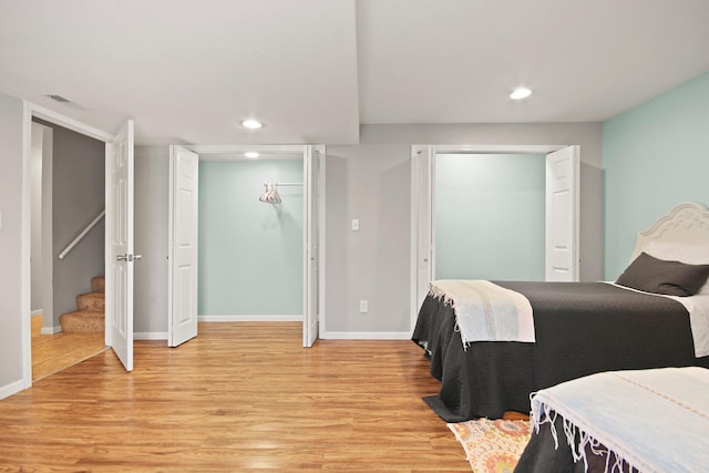 bedroom featuring recessed lighting, light wood-type flooring, and visible vents