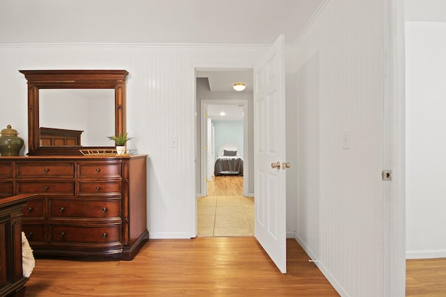 bedroom featuring baseboards and light wood-style floors