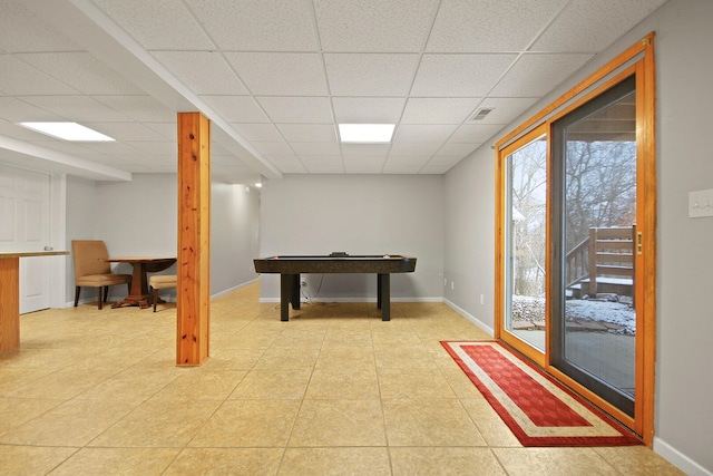 rec room featuring a paneled ceiling, baseboards, visible vents, and light tile patterned flooring