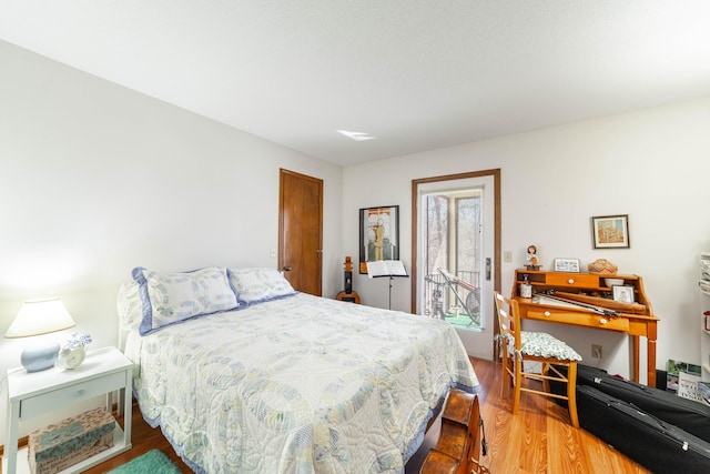 bedroom featuring wood finished floors