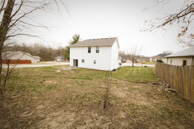 view of yard featuring a garage and fence