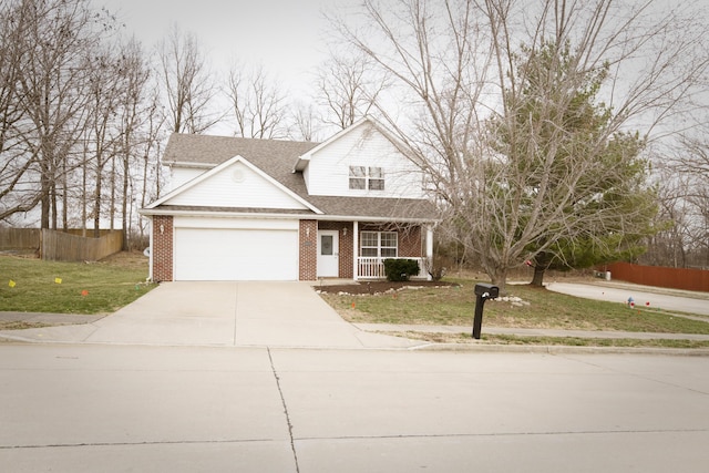 traditional-style home with a front yard, fence, driveway, covered porch, and brick siding