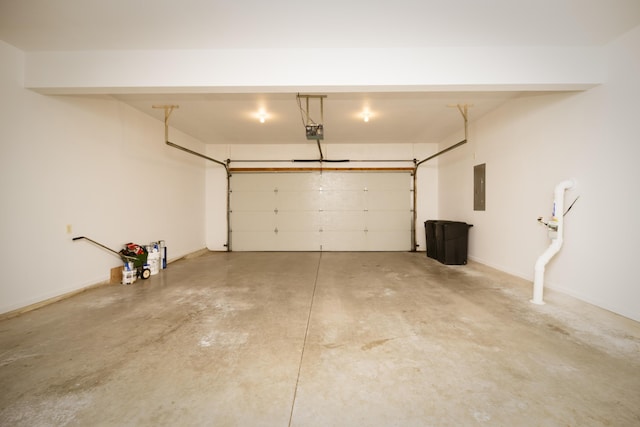 garage featuring electric panel, a garage door opener, and baseboards