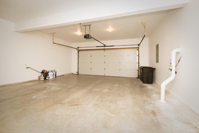 garage featuring electric panel, baseboards, and a garage door opener