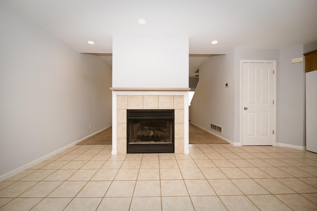 unfurnished living room featuring recessed lighting, a fireplace, visible vents, and baseboards