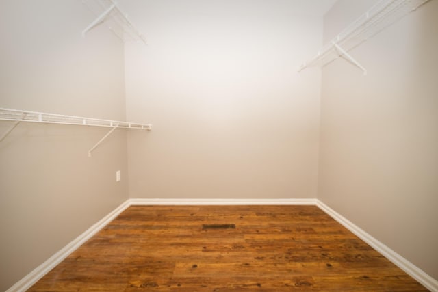 spacious closet with wood finished floors