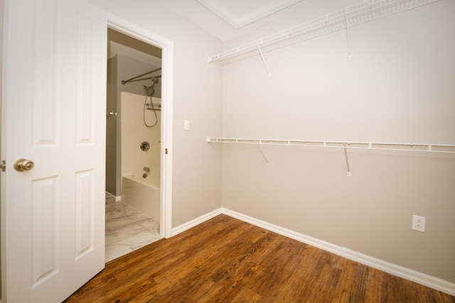 spacious closet featuring wood finished floors