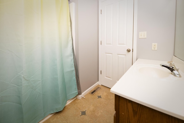 full bath featuring vanity, visible vents, baseboards, tile patterned flooring, and curtained shower