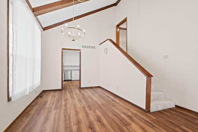 unfurnished living room featuring visible vents, beamed ceiling, high vaulted ceiling, wood finished floors, and stairs