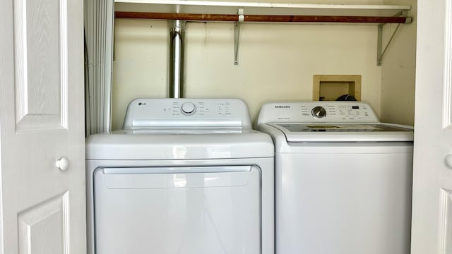 washroom with washer and dryer and laundry area