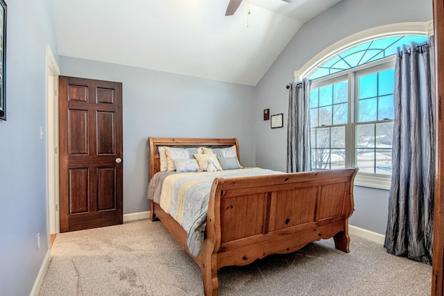 bedroom with vaulted ceiling, carpet flooring, a ceiling fan, and baseboards