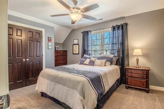 bedroom featuring baseboards, a ceiling fan, visible vents, and light carpet