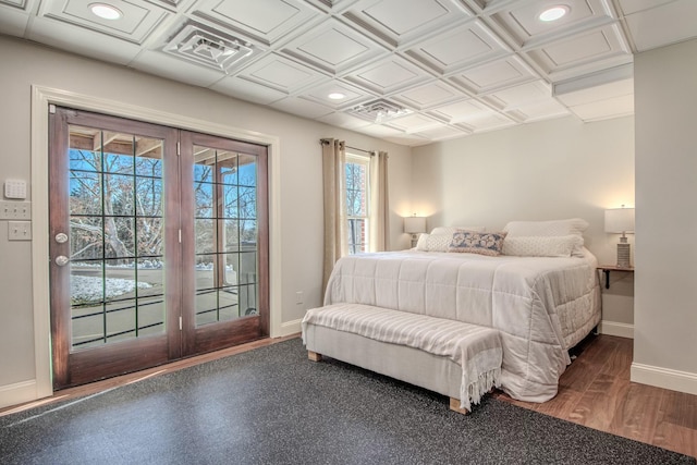 bedroom featuring recessed lighting, baseboards, and access to outside