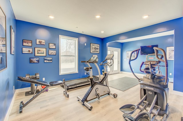 workout area featuring recessed lighting, wood finished floors, and baseboards