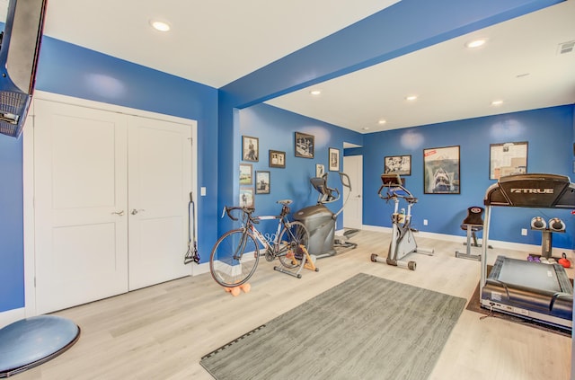 exercise area with recessed lighting, visible vents, and wood finished floors