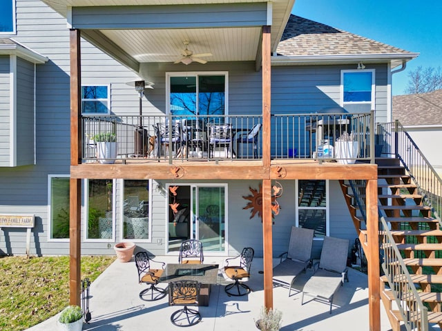 back of house with stairs, a patio area, roof with shingles, and ceiling fan