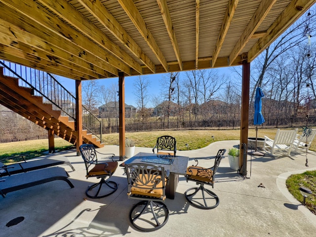 view of patio featuring stairway, a fenced backyard, and a mountain view