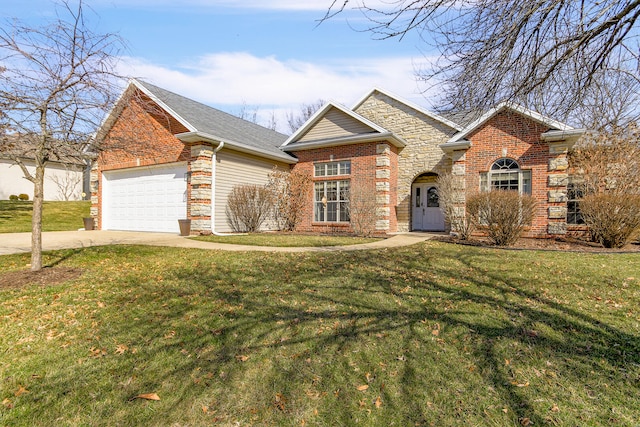 traditional home featuring stone siding, concrete driveway, an attached garage, a front yard, and brick siding