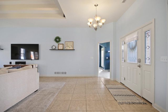 entryway featuring visible vents, baseboards, a chandelier, and tile patterned flooring