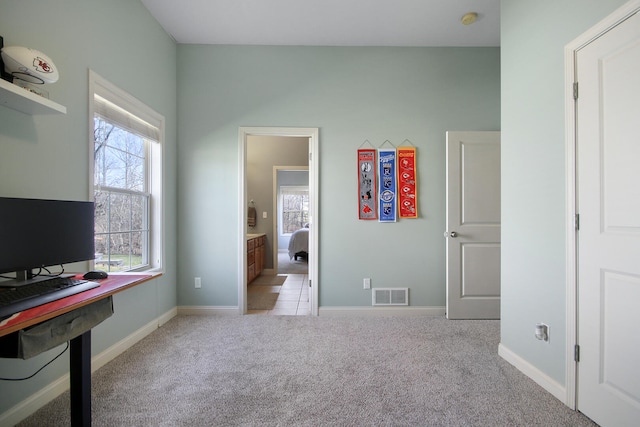 carpeted bedroom with visible vents and baseboards