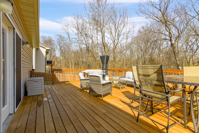 wooden terrace featuring an outdoor hangout area