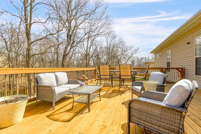 wooden terrace featuring an outdoor living space