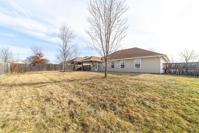 view of yard with a fenced backyard