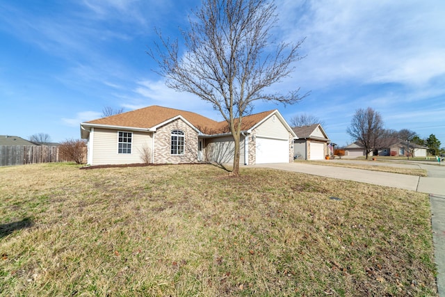 ranch-style home with a front lawn, stone siding, fence, concrete driveway, and a garage