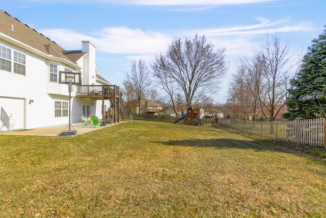 view of yard with stairway, a patio area, a playground, and a fenced backyard