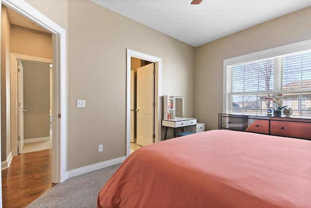 carpeted bedroom with baseboards and ceiling fan