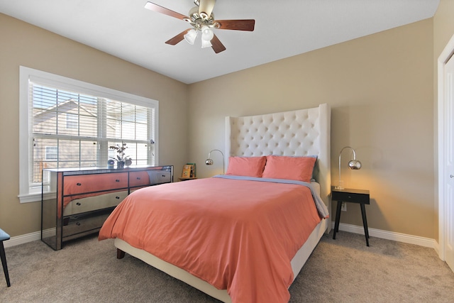 bedroom with baseboards, light colored carpet, and ceiling fan