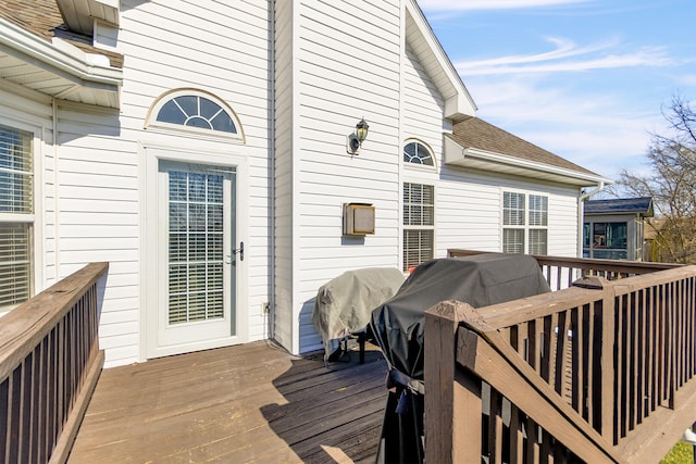 wooden terrace featuring grilling area