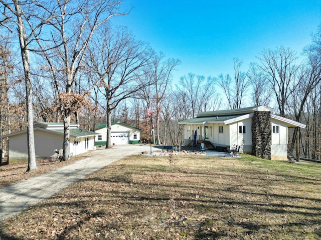 view of side of home with a yard