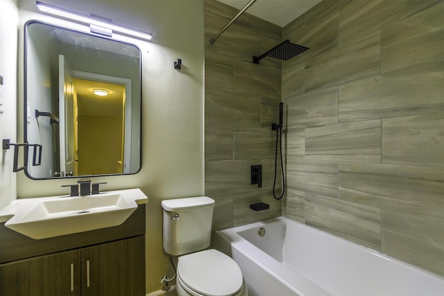 bathroom featuring vanity, bathing tub / shower combination, and toilet