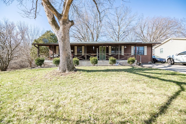 single story home featuring a porch and a front yard