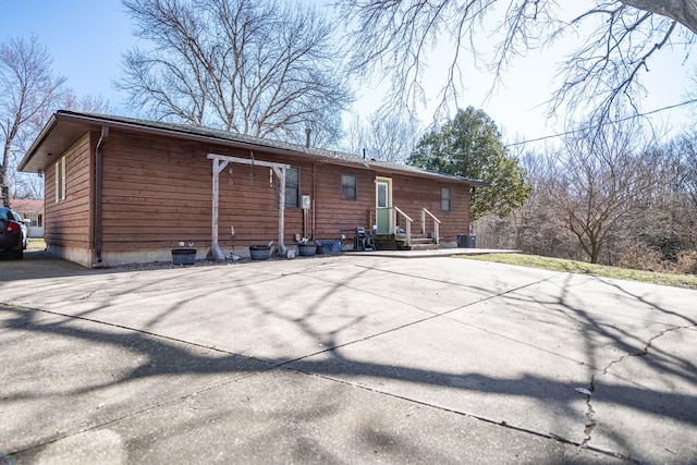 rear view of property with central air condition unit