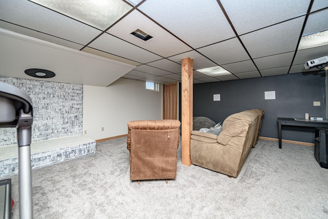 living area with a paneled ceiling, baseboards, and carpet floors