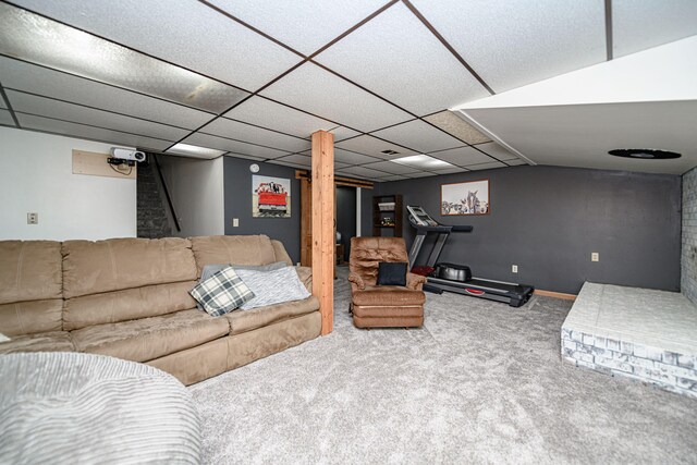 carpeted living room featuring a paneled ceiling