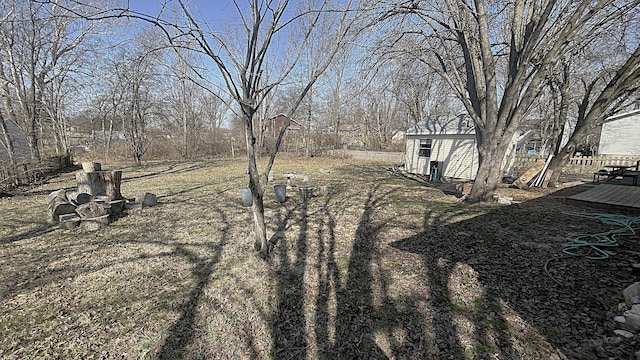 view of yard featuring an outbuilding and a wooden deck