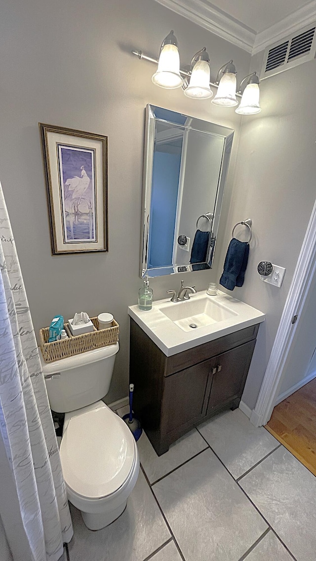 full bathroom featuring visible vents, baseboards, toilet, ornamental molding, and vanity