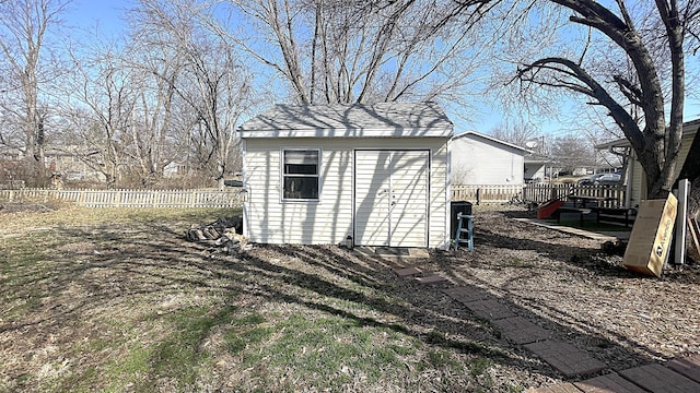 view of shed with fence