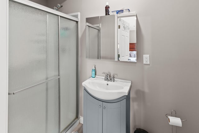 bathroom featuring vanity and a stall shower