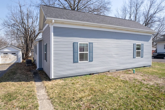 view of property exterior with central air condition unit, a yard, an outdoor structure, a shingled roof, and crawl space